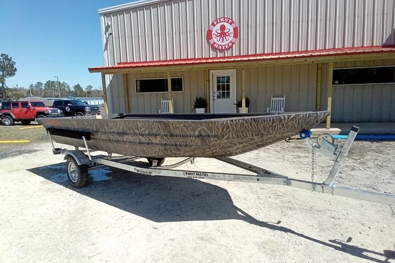 The Image of 2025 Alweld 1648VV Marsh boat on trailer outside First Mates store. - 2