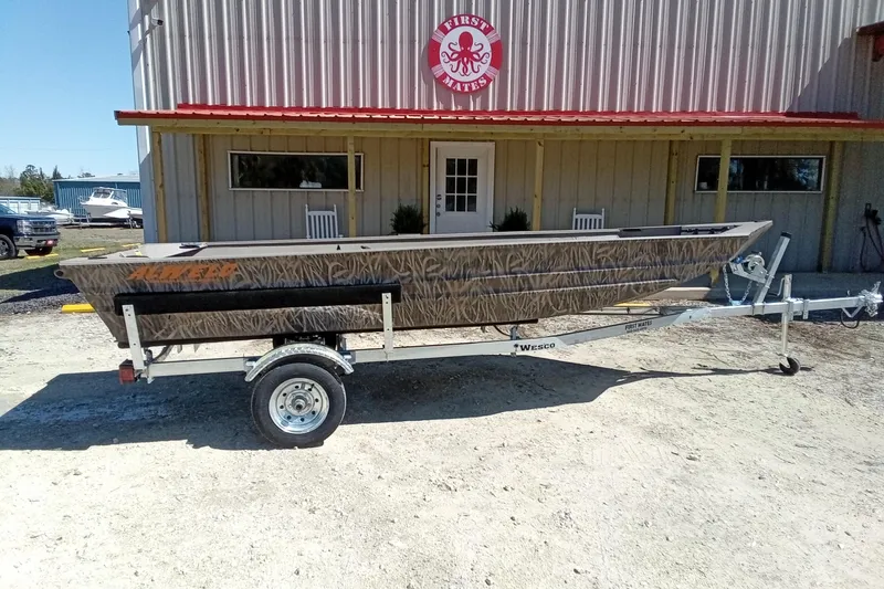 Slide: The Image of 2025 Alweld 1648VV Marsh boat on trailer outside a building. - 13