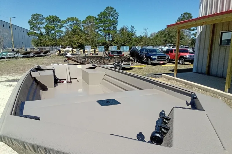 Slide: The Image of 2025 Alweld 1648VV Marsh boat in outdoor setting, surrounded by vehicles and trees. - 15