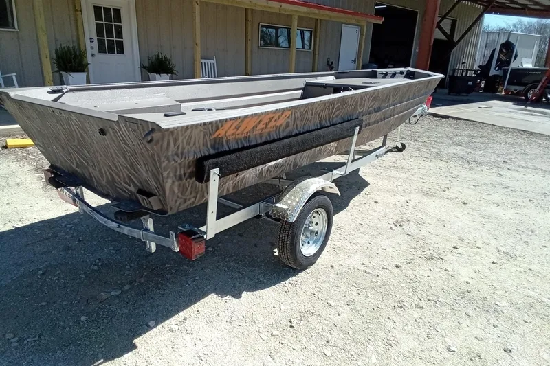 Slide: The Image of 2025 Alweld 1648VV Marsh boat on trailer, parked outdoors. - 20