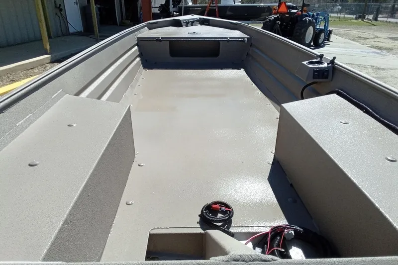 Slide: The Image of 2025 Alweld 1648VV Marsh boat interior, showcasing spacious deck and storage compartments. - 22