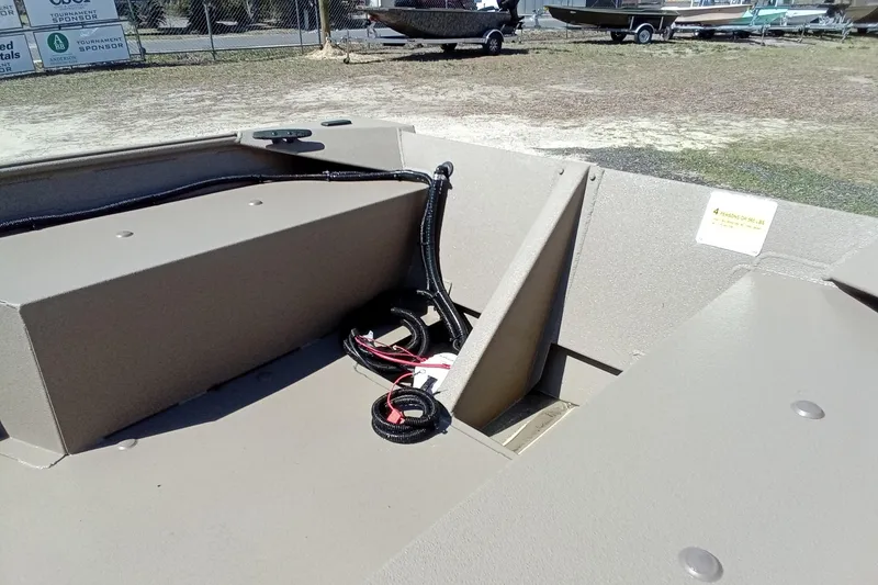 Slide: The Image of 2025 Alweld 1648VV Marsh boat interior with wiring and storage compartments. - 23