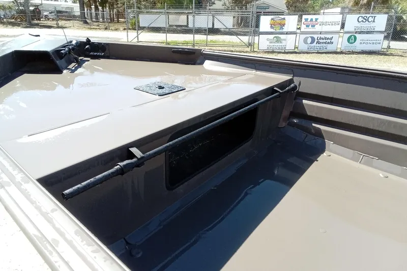 Slide: The Image of 2025 Alweld 1648VV Marsh boat interior with storage compartment and rod holder. - 7