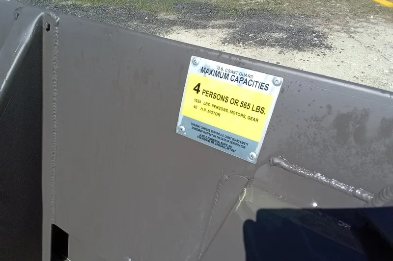 Slide: The Image of 2025 Alweld 1648VV Marsh boat capacity label, 4 persons or 565 lbs, U.S. Coast Guard compliant. - 9