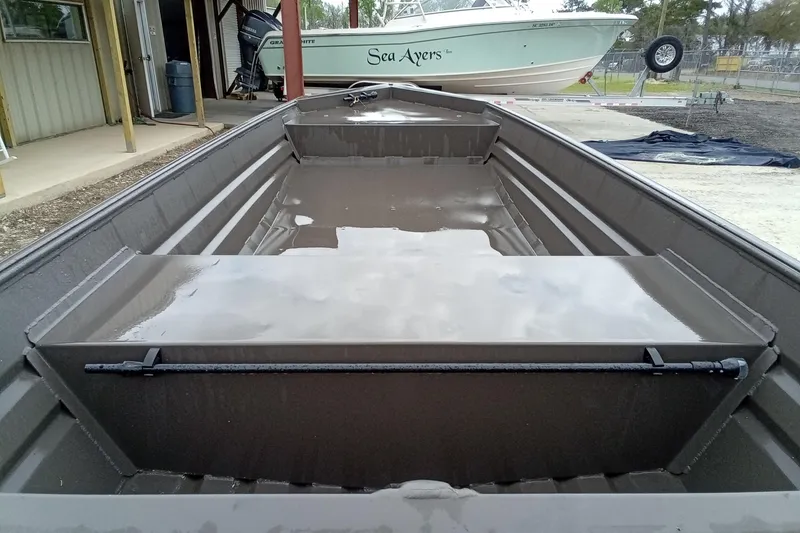 Slide: The Image of 2025 Alweld 1548VV Marsh boat interior with water, docked near other boats. - 10