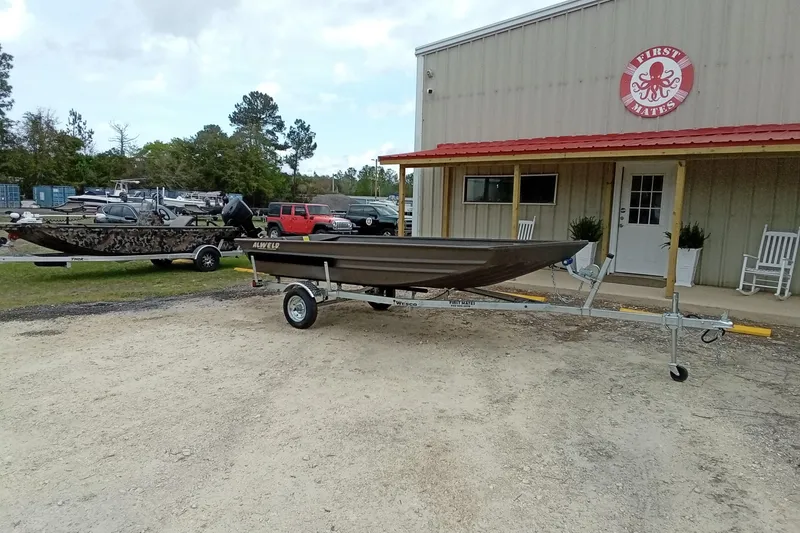 Slide: The Image of 2025 Alweld 1548VV Marsh boat on trailer outside dealership. - 3