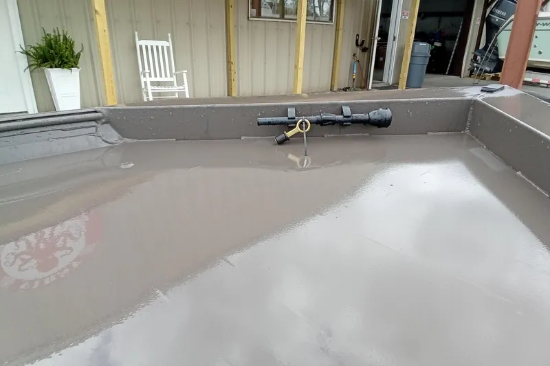 Slide: The Image of 2025 Alweld 1548VV Marsh boat interior with clean, wet surface and mounted equipment. - 6