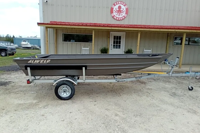 Slide: The Image of 2025 Alweld 1548VV Marsh boat on trailer outside a building. - 7