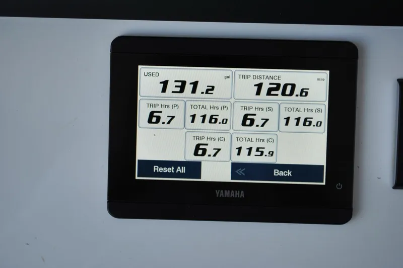 Slide: The Image of Yamaha display showing fuel usage and trip data on 2025 Regulator 34 Center Console. - 32