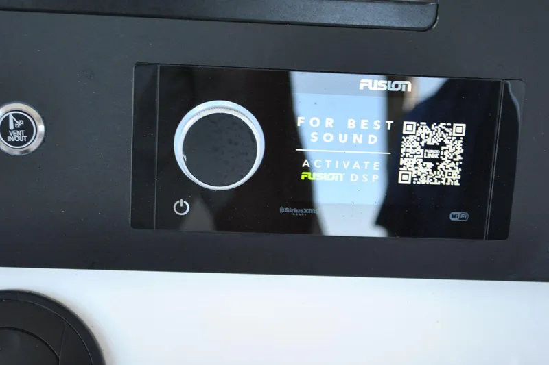 Slide: The Image of Control panel of 2025 Regulator 34 Center Console with Fusion DSP activation display. - 33