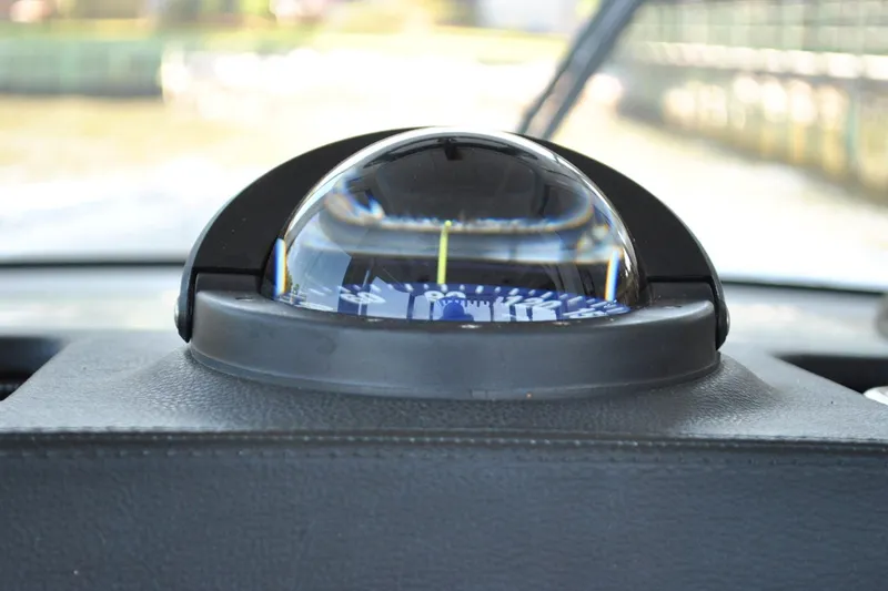 Slide: The Image of Compass on 2025 Regulator 34 Center Console boat dashboard. - 34