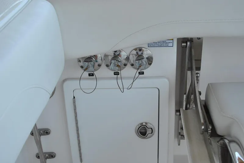 Slide: The Image of 2025 Regulator 34 Center Console boat interior with control panel and seating. - 39