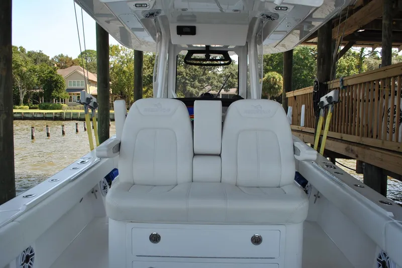 Slide: The Image of 2025 Regulator 34 Center Console boat with white seating and spacious deck. - 41