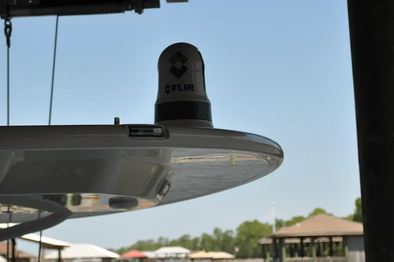 Slide: The Image of 2025 Regulator 34 Center Console with FLIR camera on T-top, dockside view. - 46