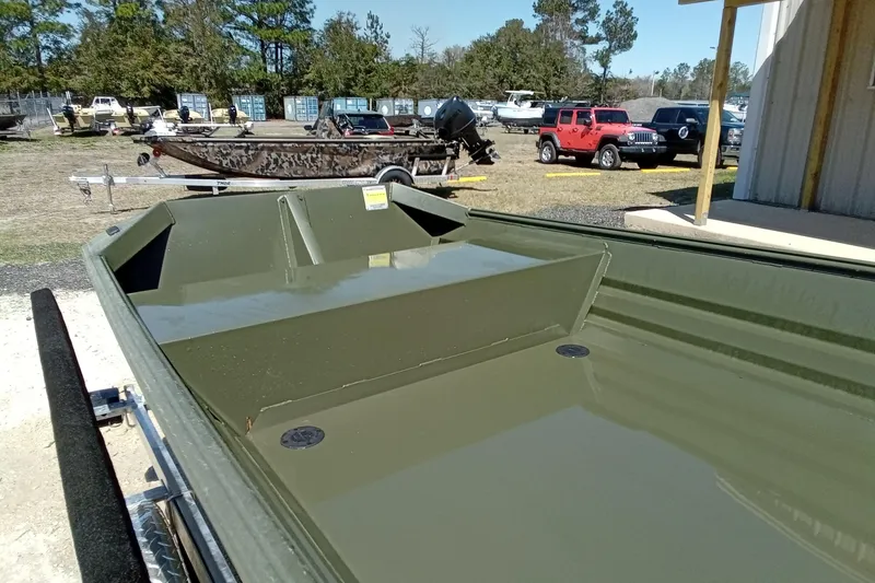 Slide: The Image of 2025 Alweld 1542 Flat Marsh boat displayed outdoors on a trailer. - 7