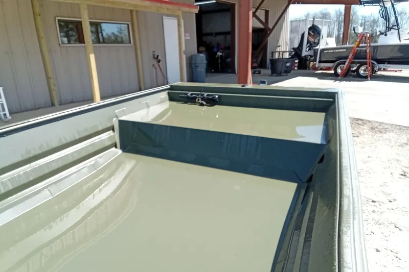 Slide: The Image of 2025 Alweld 1542 Flat Marsh boat in a workshop setting, showcasing interior details. - 8