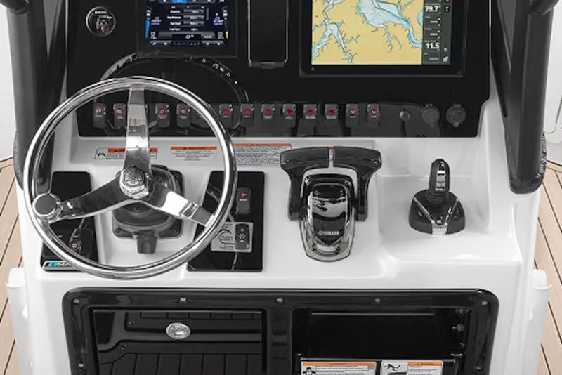 Slide: The Image of Yamaha Boats 2026 255 FSH Sport H dashboard with steering wheel and navigation controls. - 4