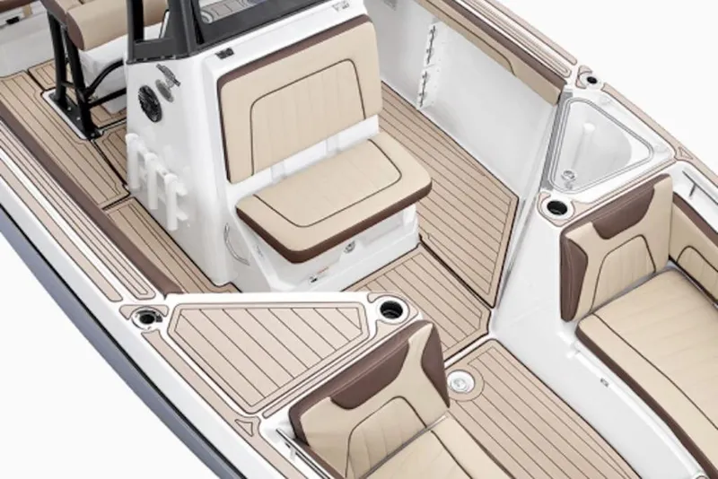 Slide: The Image of 2026 Yamaha Boats 255 FSH Sport H interior with beige seating and sleek design. - 5