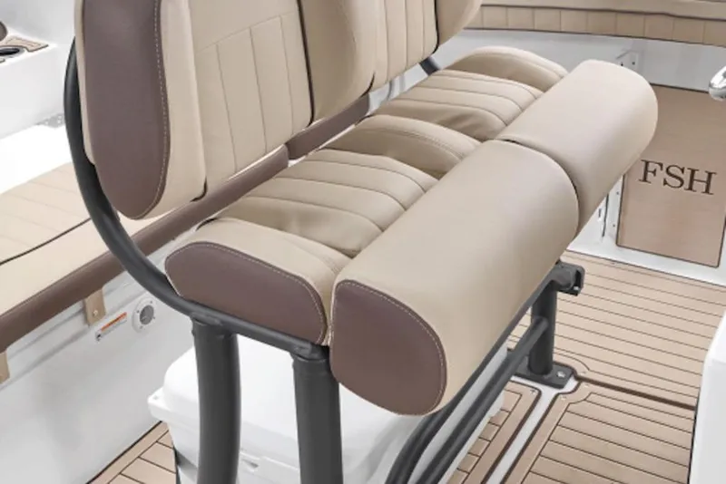Slide: The Image of 2026 Yamaha Boats 255 FSH Sport H interior seating with beige and brown upholstery. - 6