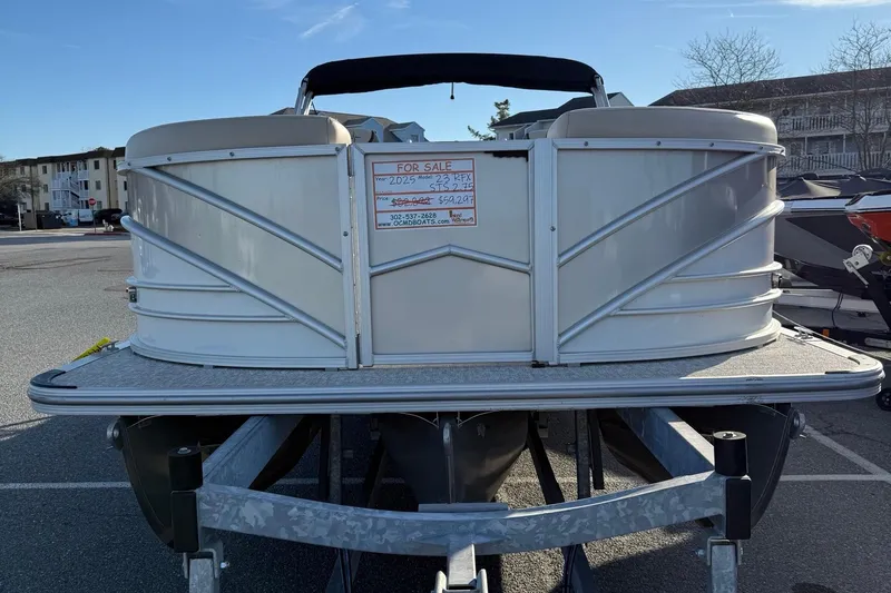Slide: The Image of 2026 Berkshire 23RFX STS pontoon boat for sale on trailer in parking lot. - 28