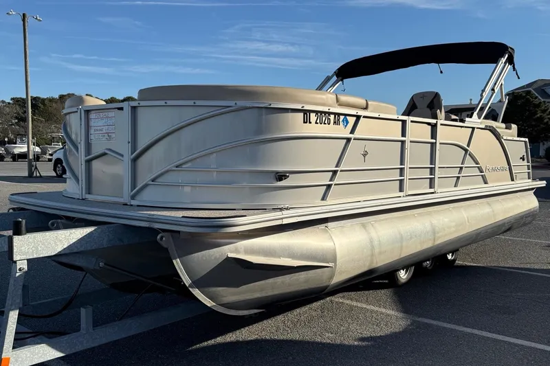 Slide: The Image of 2026 Berkshire 23RFX STS pontoon boat on trailer in parking lot. - 29