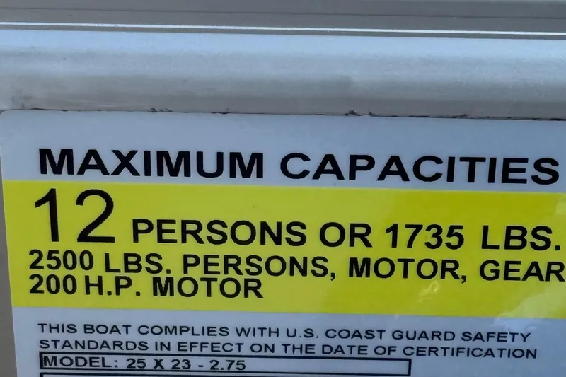 Slide: The Image of Maximum capacity label for 2026 Berkshire 23RFX STS boat, 12 persons or 1735 lbs. - 42
