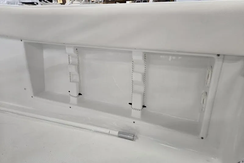Slide: The Image of 2026 Sea Hunt Ultra 219 boat interior detail with storage compartment and straps. - 13