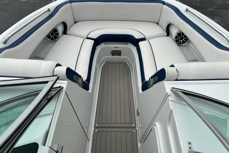 Slide: The Image of 2021 Crownline Eclipse E235 SURF boat interior with white and blue seating. - 11