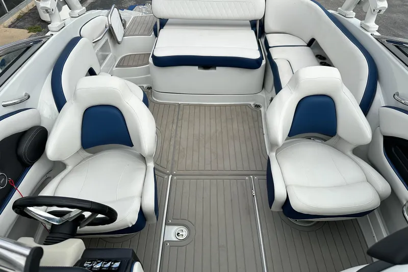 Slide: The Image of 2021 Crownline Eclipse E235 SURF boat interior with white and blue seating. - 14