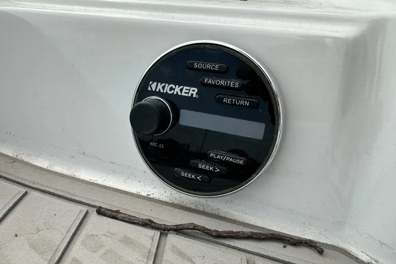Slide: The Image of Kicker audio control panel on 2021 Crownline Eclipse E235 SURF boat. - 16
