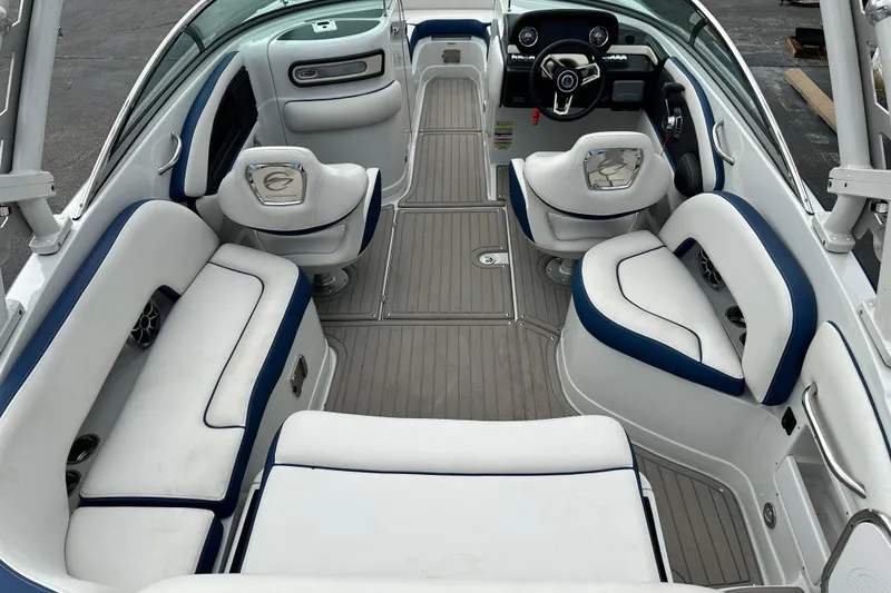Slide: The Image of 2021 Crownline Eclipse E235 SURF boat interior with white and blue seating. - 5