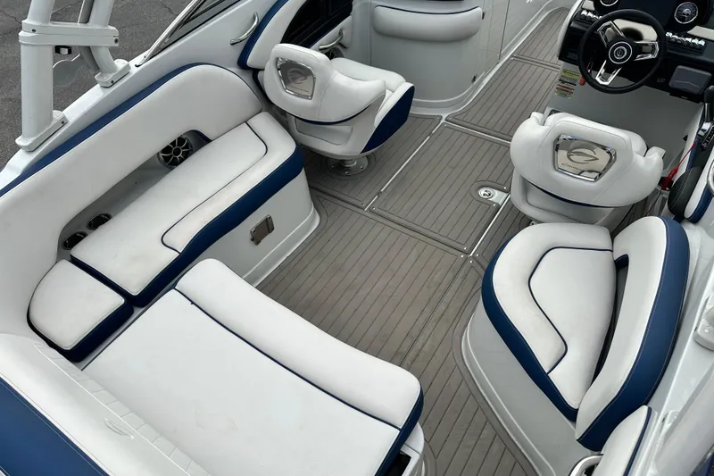 Slide: The Image of 2021 Crownline Eclipse E235 SURF boat interior with white and blue seating. - 6