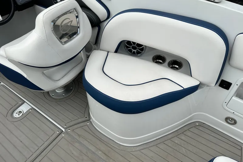 Slide: The Image of 2021 Crownline Eclipse E235 SURF boat interior with white and blue seating. - 7