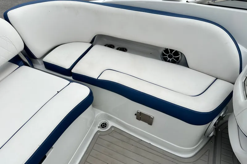 Slide: The Image of 2021 Crownline Eclipse E235 SURF boat interior seating with white and blue upholstery. - 8