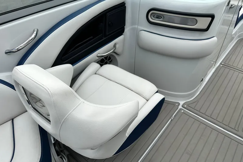 Slide: The Image of 2021 Crownline Eclipse E235 SURF boat interior with white and blue seating. - 9