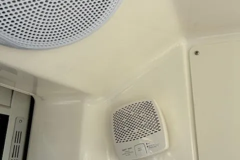 Slide: The Image of 2024 Bayliner Trophy T25 Explorer cabin with speaker and control panel. - 17