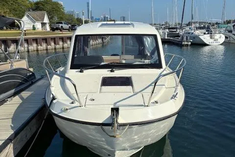 Slide: The Image of 2024 Bayliner Trophy T25 Explorer docked in a marina, front view. - 4
