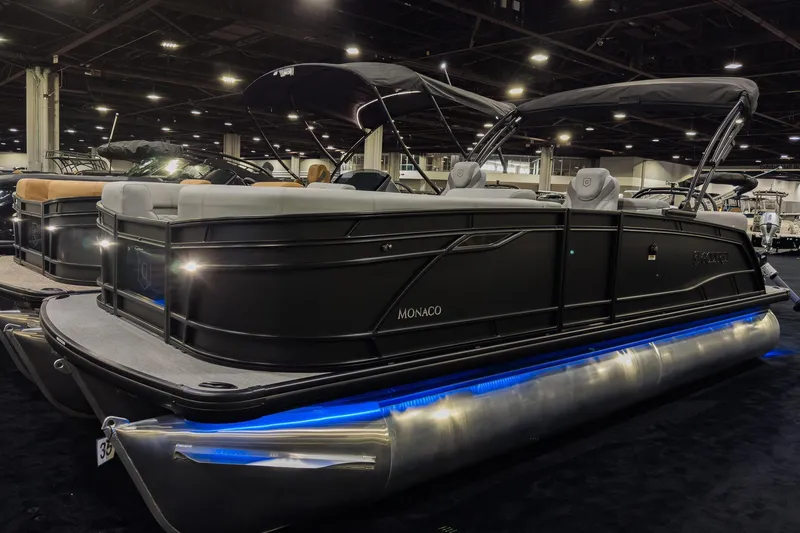 The Image of 2026 Godfrey Monaco 235 Split Bench pontoon boat with sleek design and blue underglow lighting. - 0