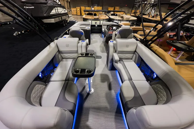 Slide: The Image of 2026 Godfrey Monaco 235 Split Bench boat interior with luxurious seating and ambient lighting. - 19