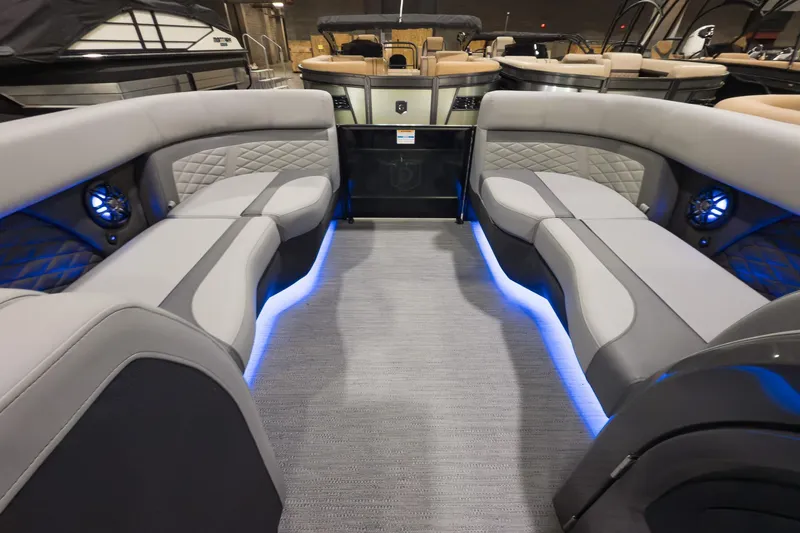 Slide: The Image of 2026 Godfrey Monaco 235 Split Bench interior with modern seating and ambient blue lighting. - 21