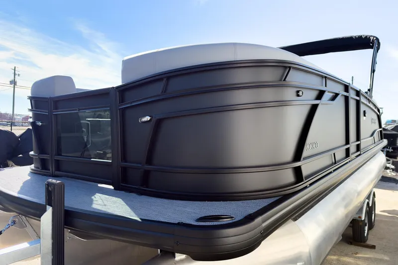 Slide: The Image of 2026 Godfrey Monaco 235 Split Bench pontoon boat with sleek black exterior design. - 33