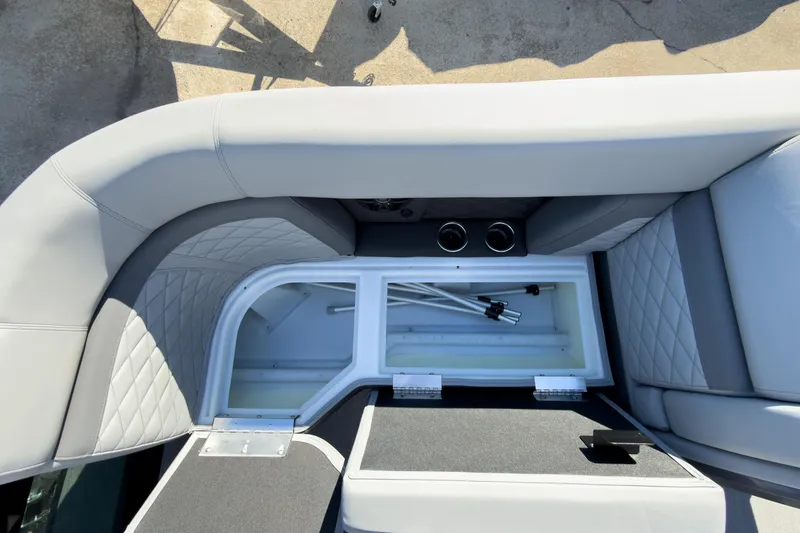 Slide: The Image of 2026 Godfrey Monaco 235 Split Bench interior storage compartment with sleek seating design. - 41