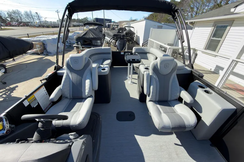 Slide: The Image of 2026 Godfrey Monaco 235 Split Bench boat interior with luxurious seating and modern design. - 47