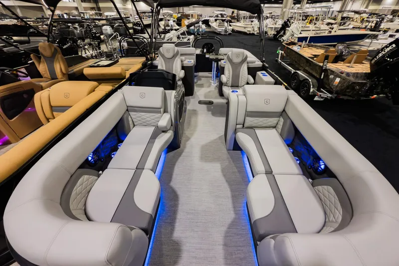 Slide: The Image of 2026 Godfrey Monaco 235 Split Bench pontoon boat interior with luxurious seating and ambient lighting. - 5