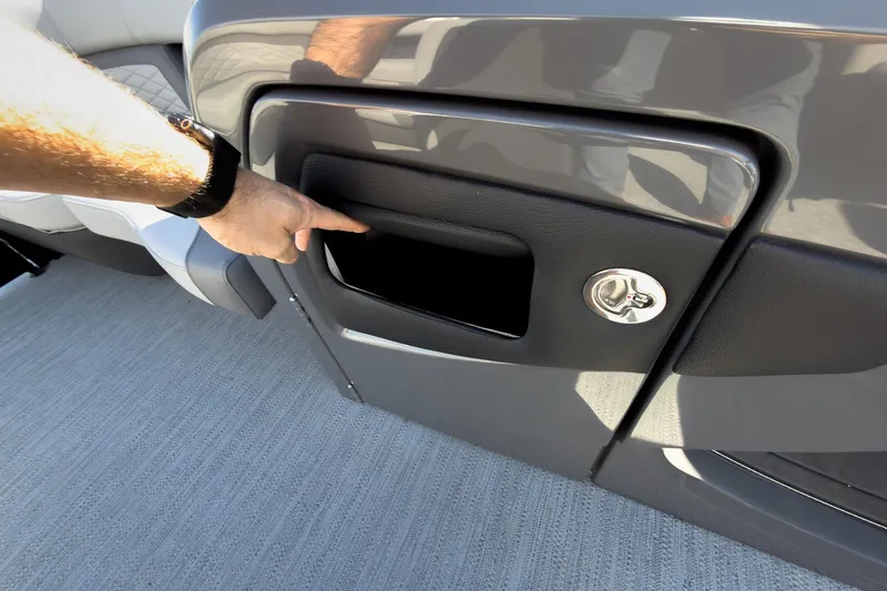 Slide: The Image of 2026 Godfrey Monaco 235 Split Bench storage compartment with lock, featuring sleek design and functionality. - 50