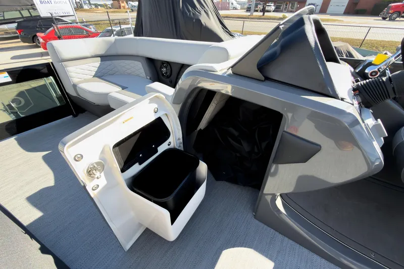 Slide: The Image of 2026 Godfrey Monaco 235 Split Bench interior with open storage compartment and seating. - 51