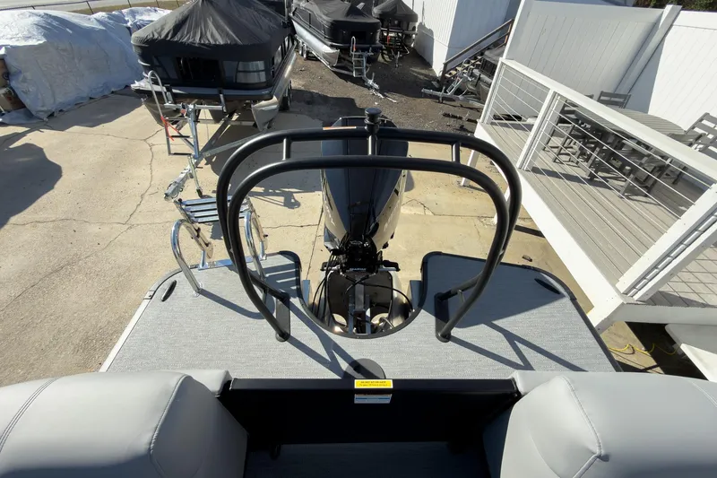 Slide: The Image of 2026 Godfrey Monaco 235 Split Bench boat with rear view of motor and seating area. - 67