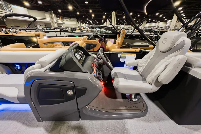 Slide: The Image of Luxurious interior of 2026 Godfrey Monaco 235 Split Bench boat at a showroom. - 9