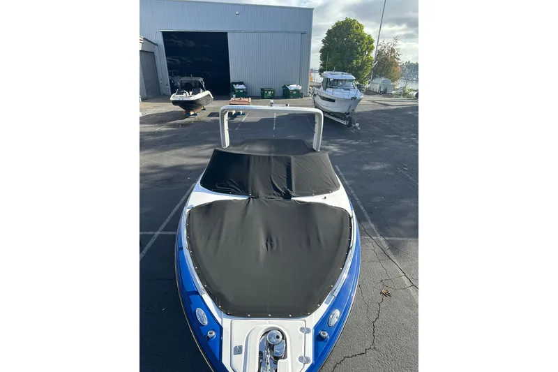 Slide: The Image of 2019 Monterey 278SS Super Sport boat covered in a parking lot. - 10