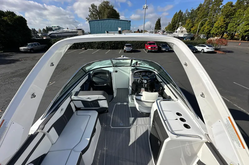 Slide: The Image of 2019 Monterey 278SS Super Sport boat parked in a lot, showcasing sleek seating design. - 14